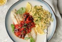 Bright Baked Fish with Cherry Tomato Olive Sauce and Zesty Lemon Chive Asiago Orzo