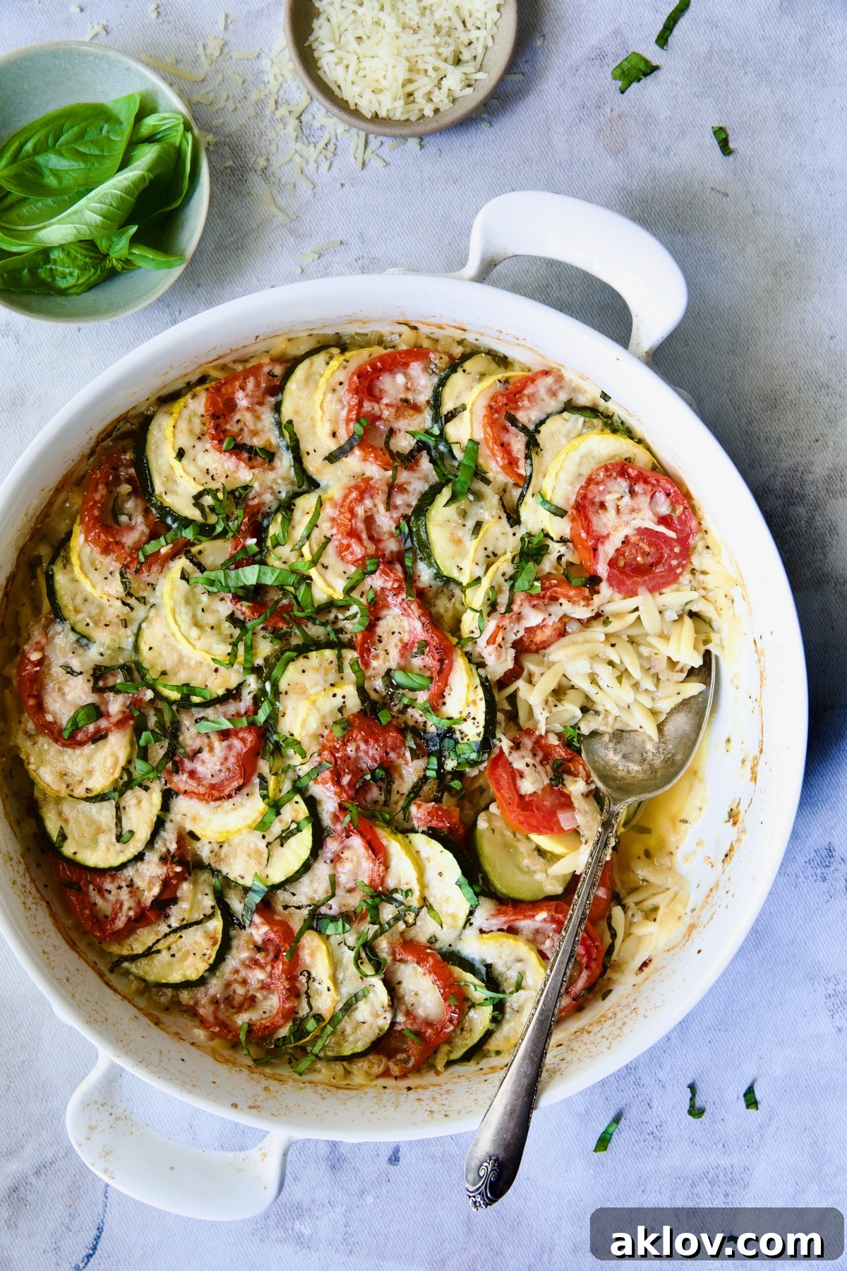 A serving of Orzo Vegetable Tian presented on a plate, ready to be enjoyed.