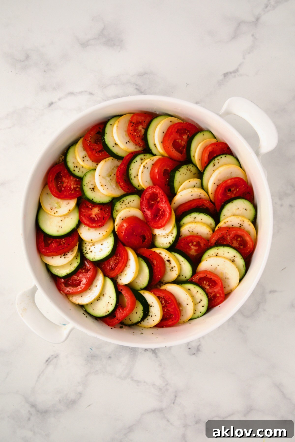 All the vegetables beautifully arranged on top of the orzo mixture, filling the baking dish.