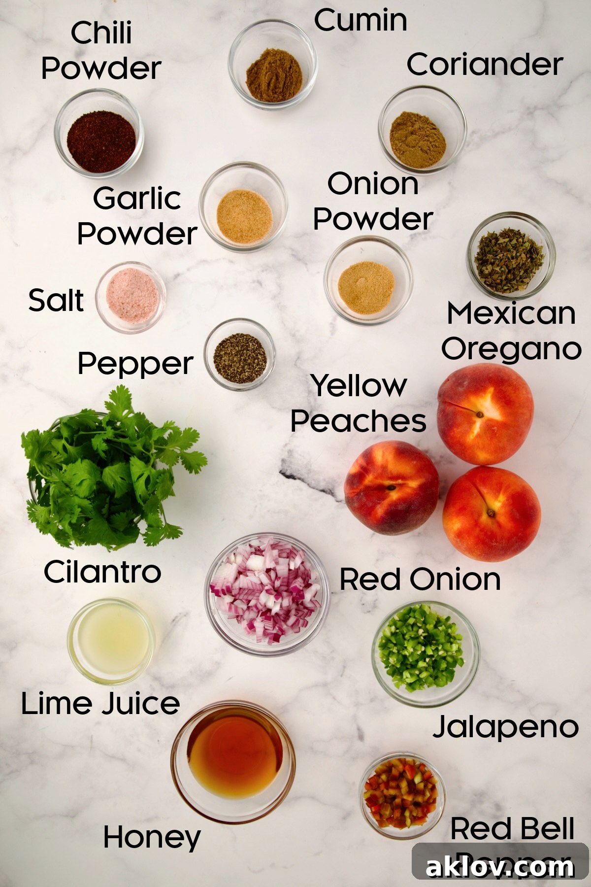 A collection of fresh ingredients for Peach Salsa, including diced peaches, chopped red onion, jalapeño, cilantro, and red bell pepper, neatly arranged in glass bowls.