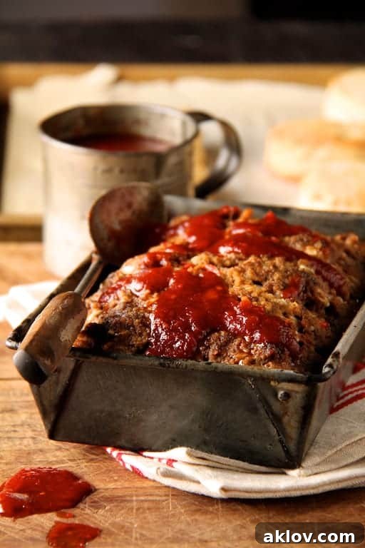 Chili Glazed Meatloaf in rustic loaf pan.
