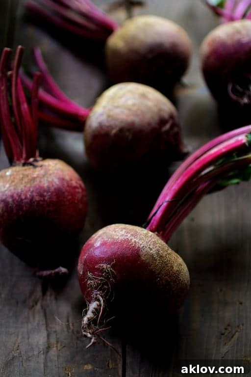 Photo of fresh, raw, uncooked red beets.