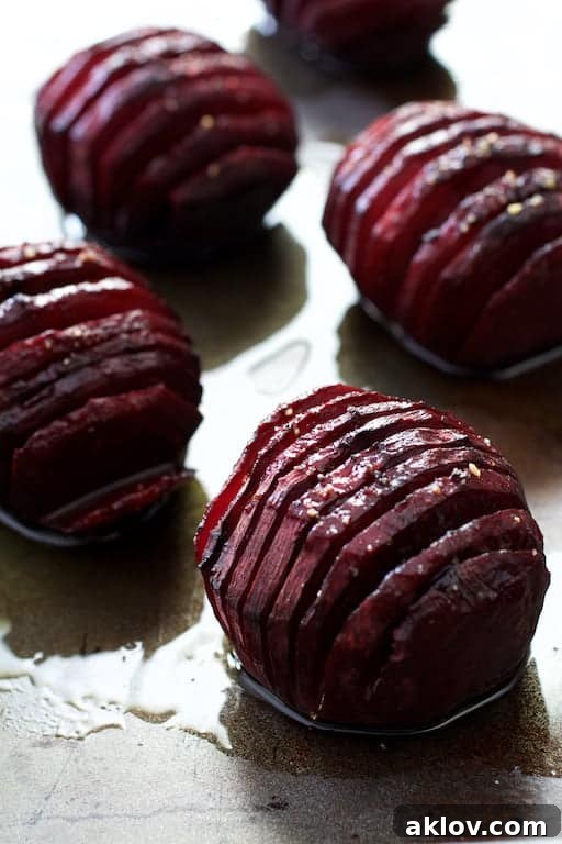 Fan-Cut Roasted Beets with Zesty Dill Dressing 7 Photo of roasted red hasselback beets.