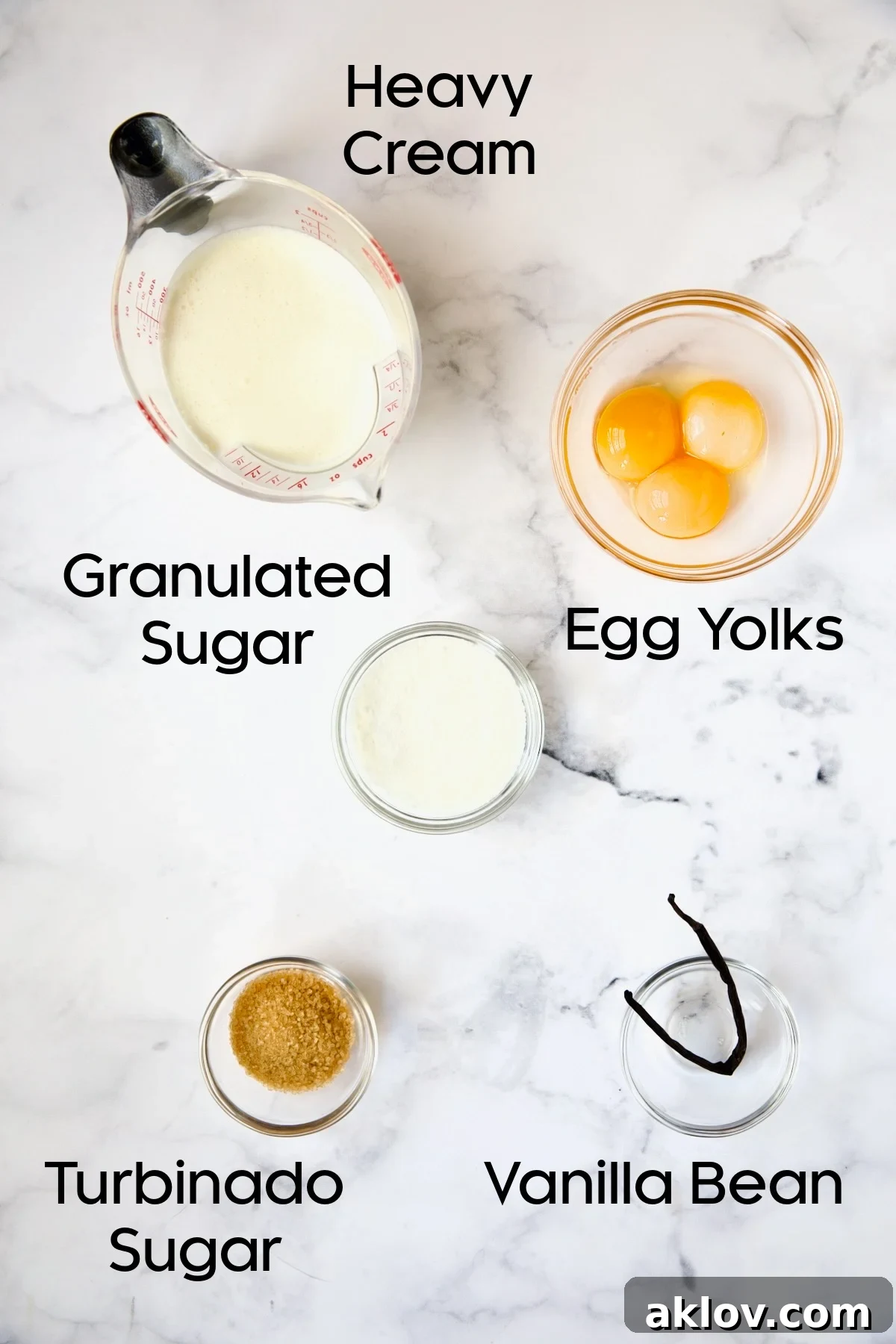 A selection of fresh ingredients for Classic Crème Brûlée for Two, neatly arranged in glass bowls.
