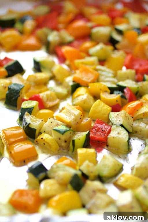 Photo of vegetables on baking sheet after being roasted.