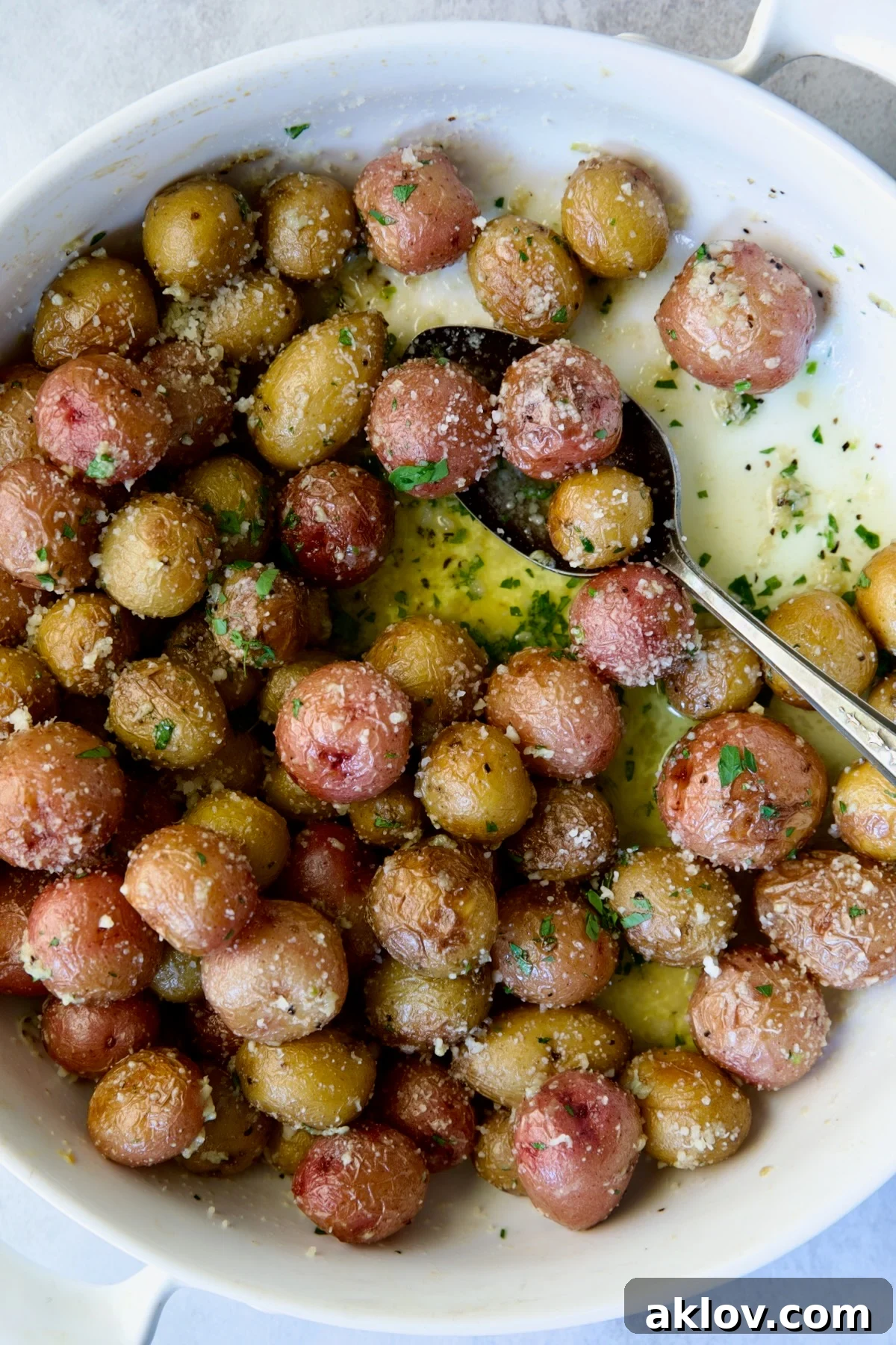 A close-up shot of the finished Garlic Butter Parmesan Mini Potatoes, showing their rich color and delicious coating.