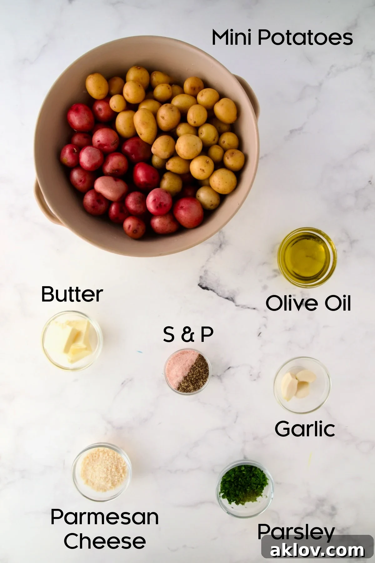 Ingredients for Garlic Butter Parmesan Mini Potatoes in glass bowls with potatoes in a colander.