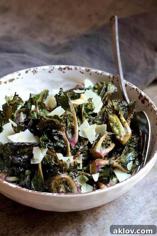 Crispy Balsamic Parmesan Kale Sprouts 6 Balsamic Roasted Kale Sprouts in white bowl with serving fork.