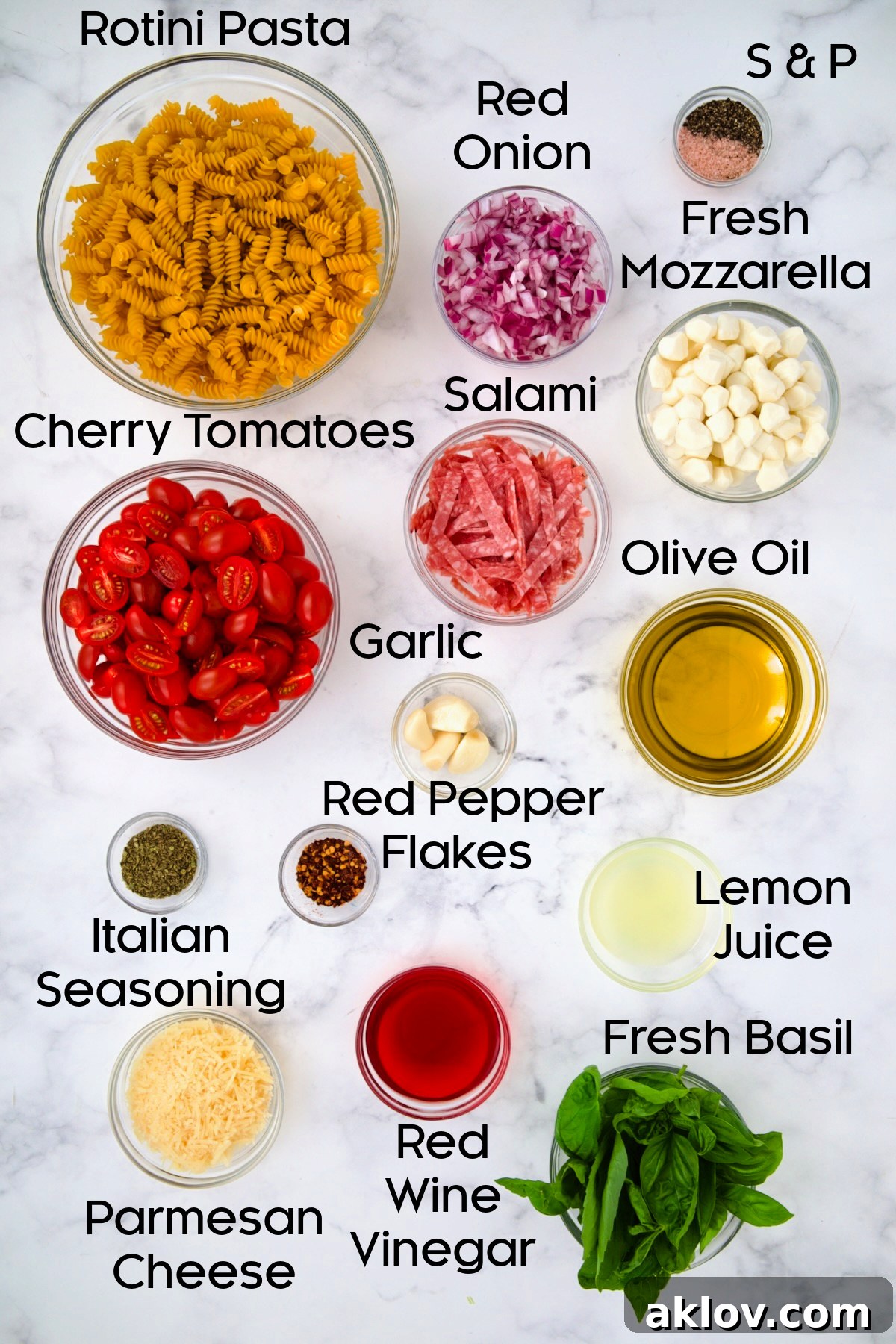 Ingredients for Caprese Pasta Salad in glass bowls.