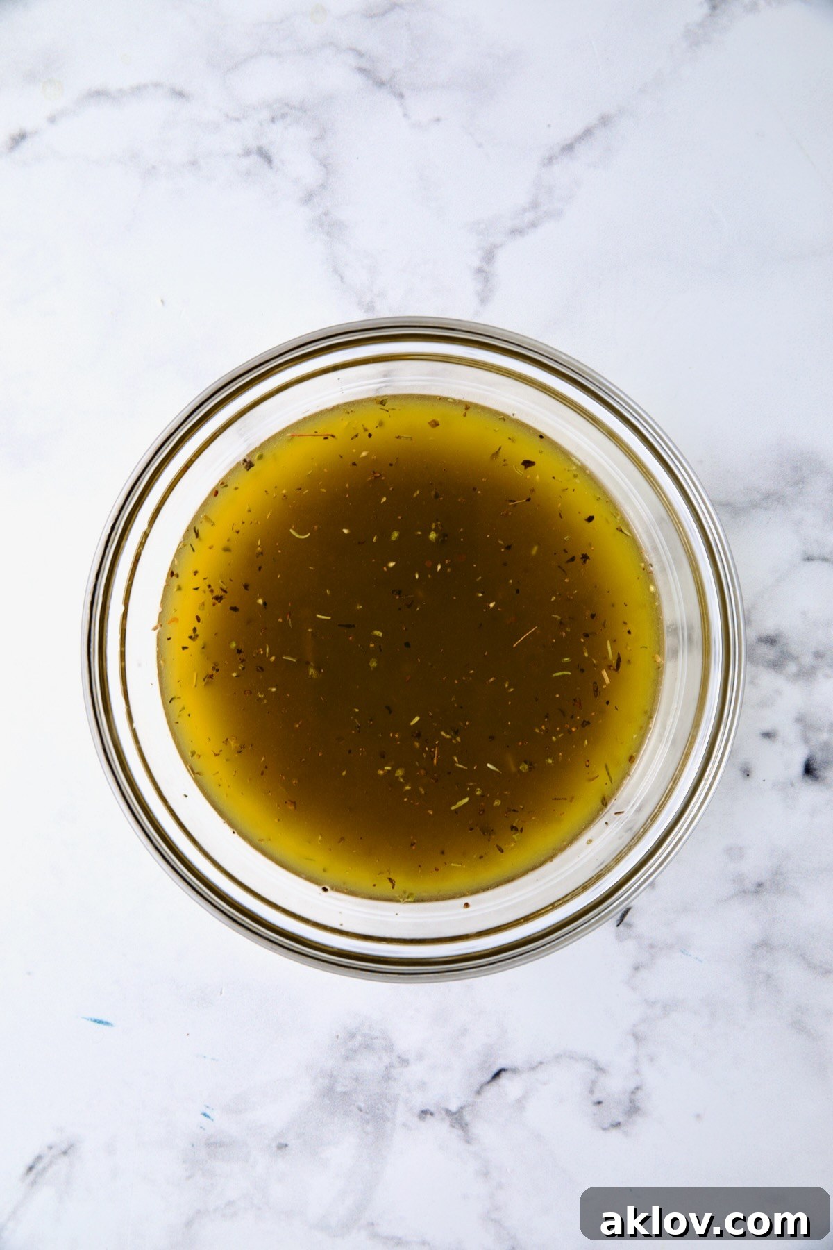 Salad dressing in glass bowl.