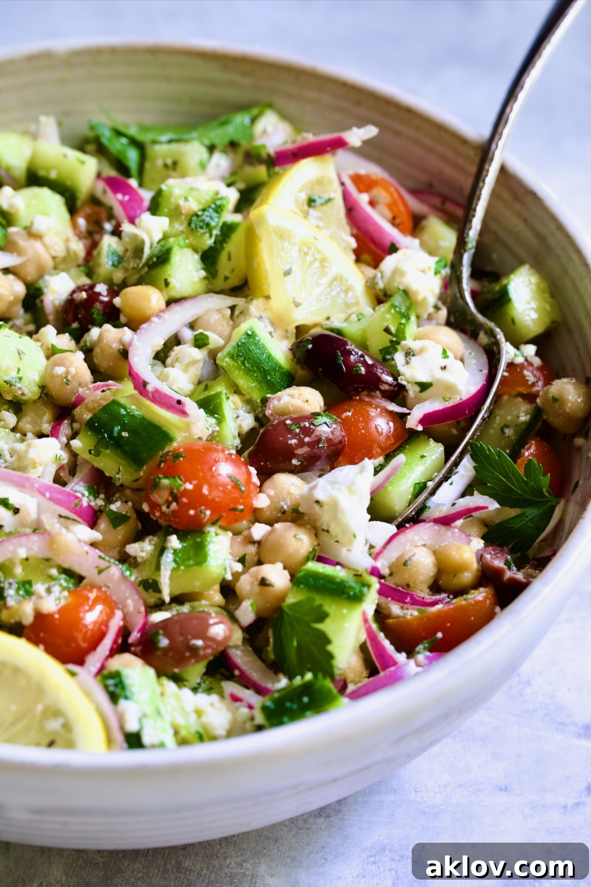 Greek Cucumber Salad with serving spoon.