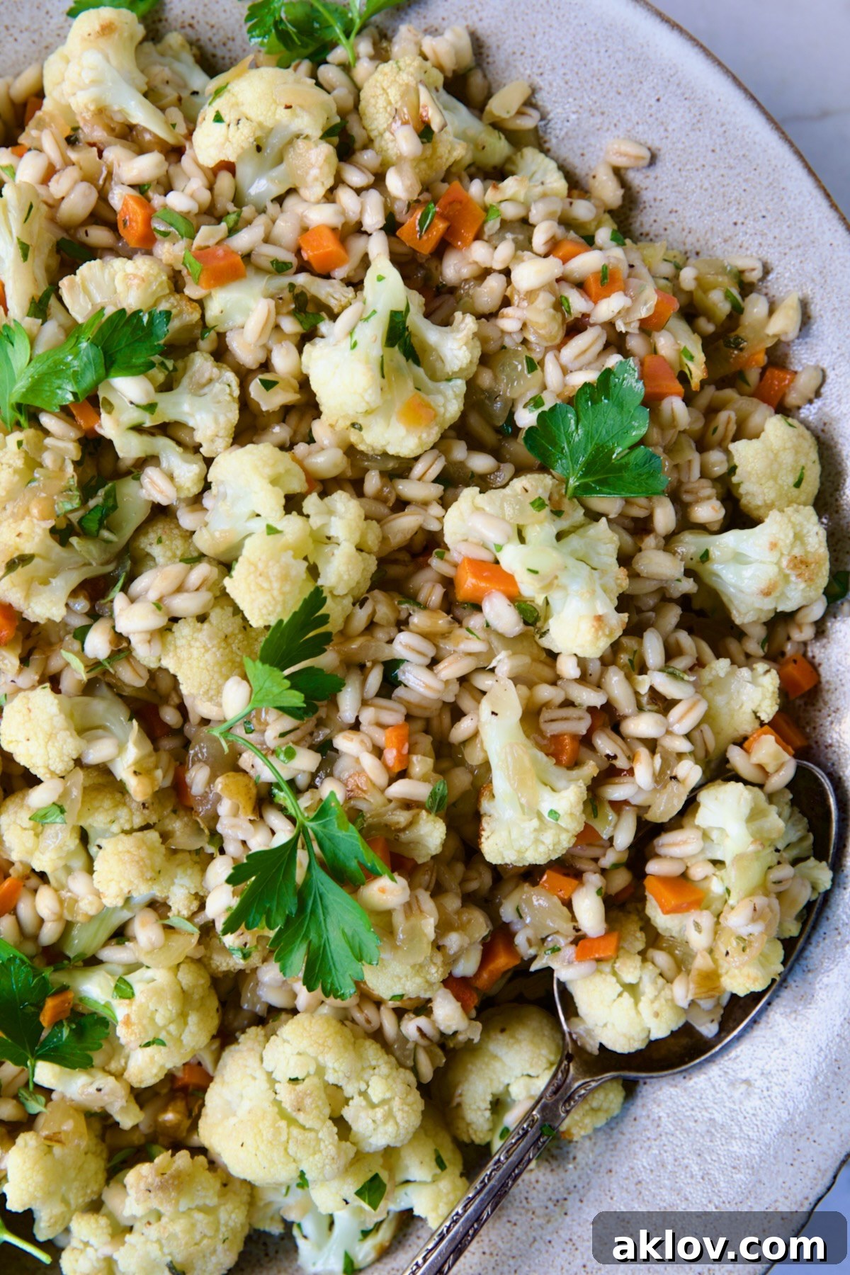 A vibrant close-up of the delicious Barley Pilaf with Roasted Cauliflower, artfully arranged and ready to be savored.
