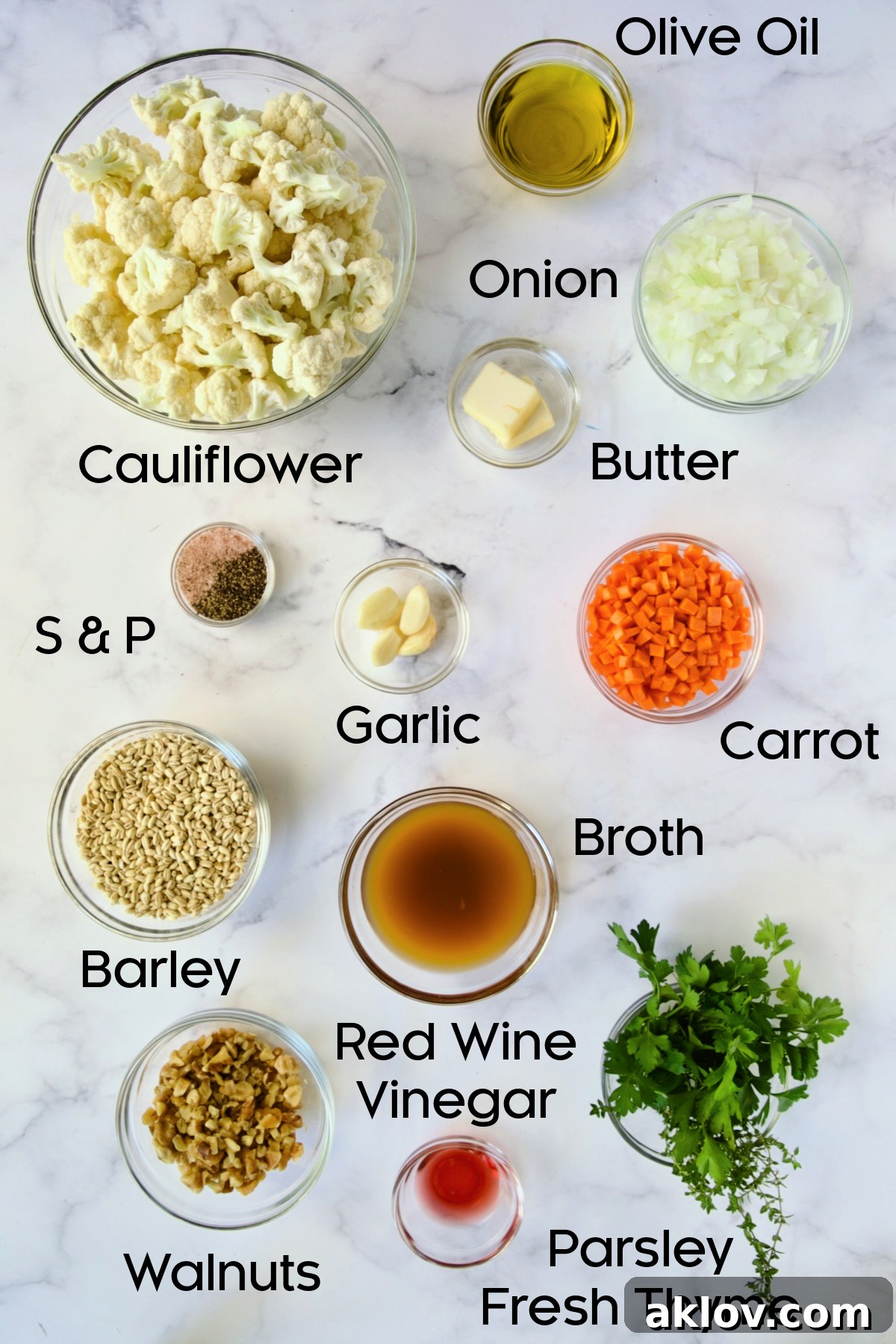 Fresh ingredients for Barley Pilaf with Roasted Cauliflower meticulously arranged in glass bowls.