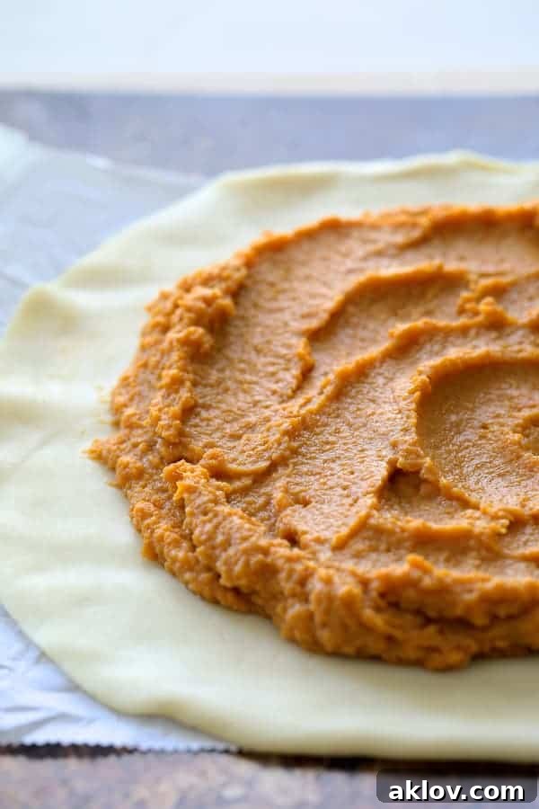 Process of sweet potato combination on dough before folding edges over and before baking.