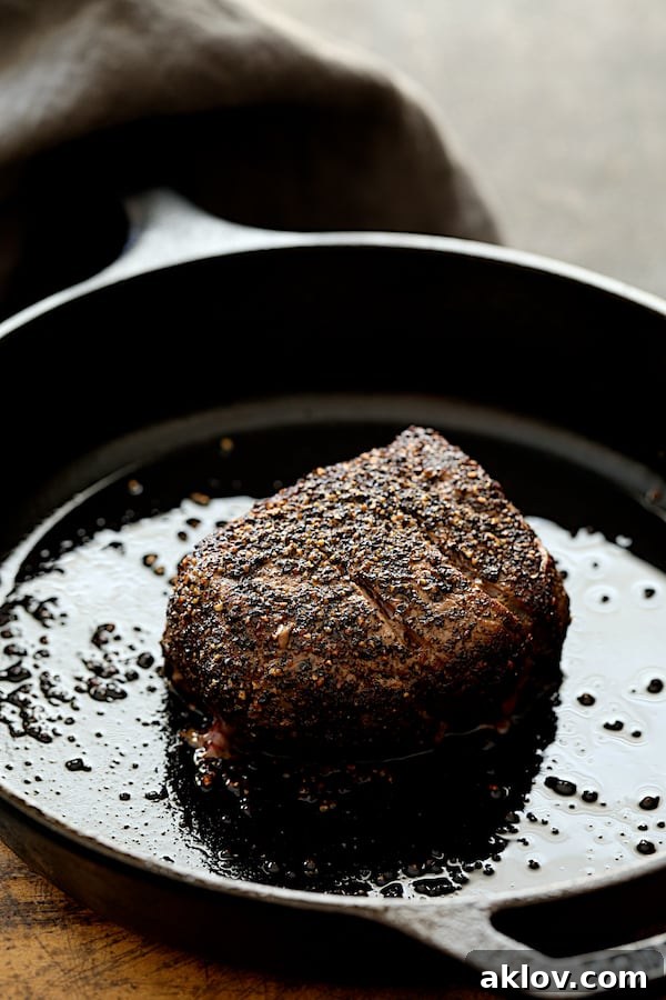 Photo of browned steak in cast iron skillet.