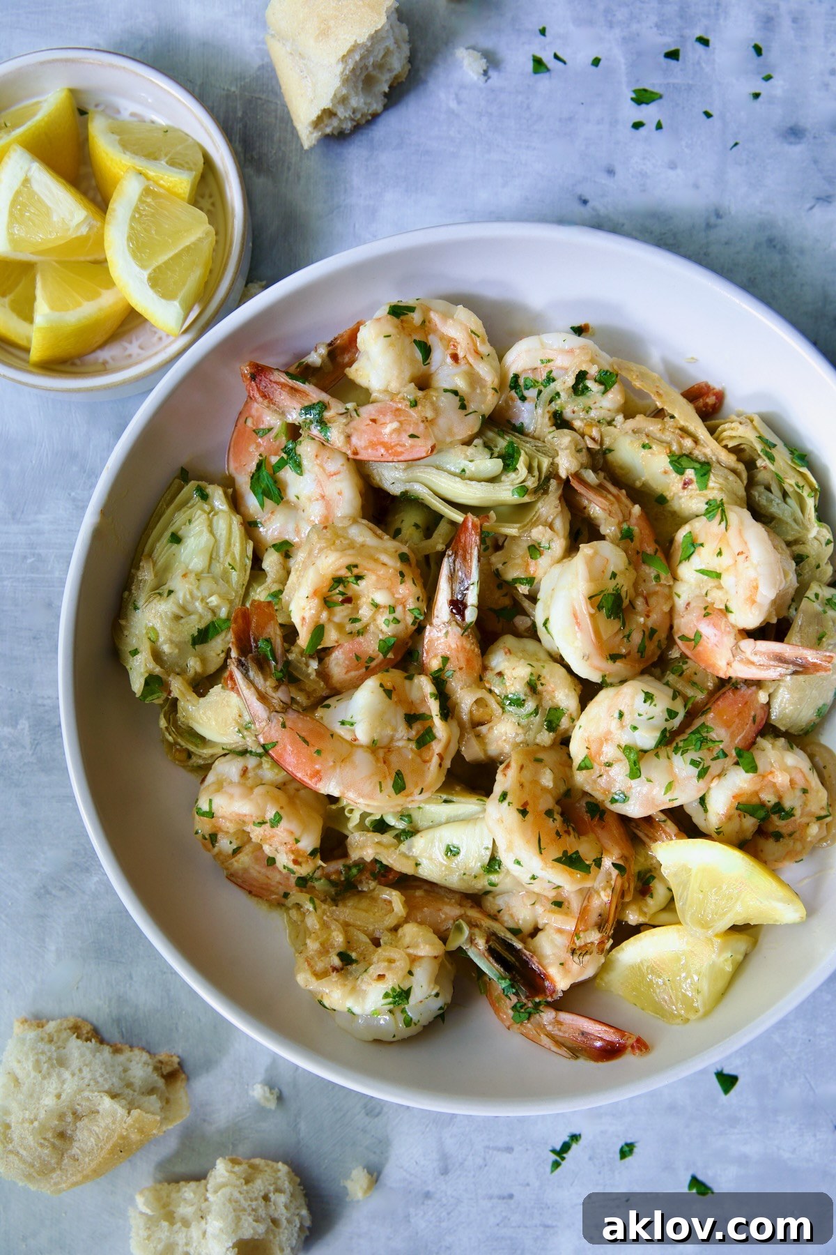 A beautifully presented bowl of Shrimp Scampi with Artichokes, ready for a delicious meal.