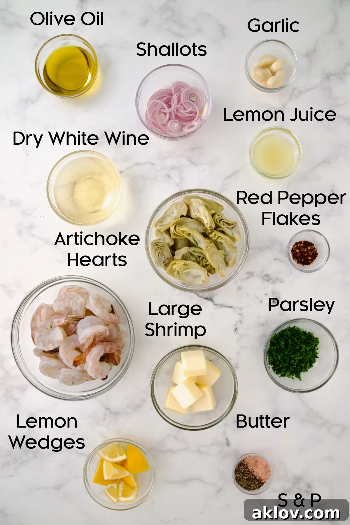 Ingredients for Shrimp Scampi with Artichokes in glass bowls.