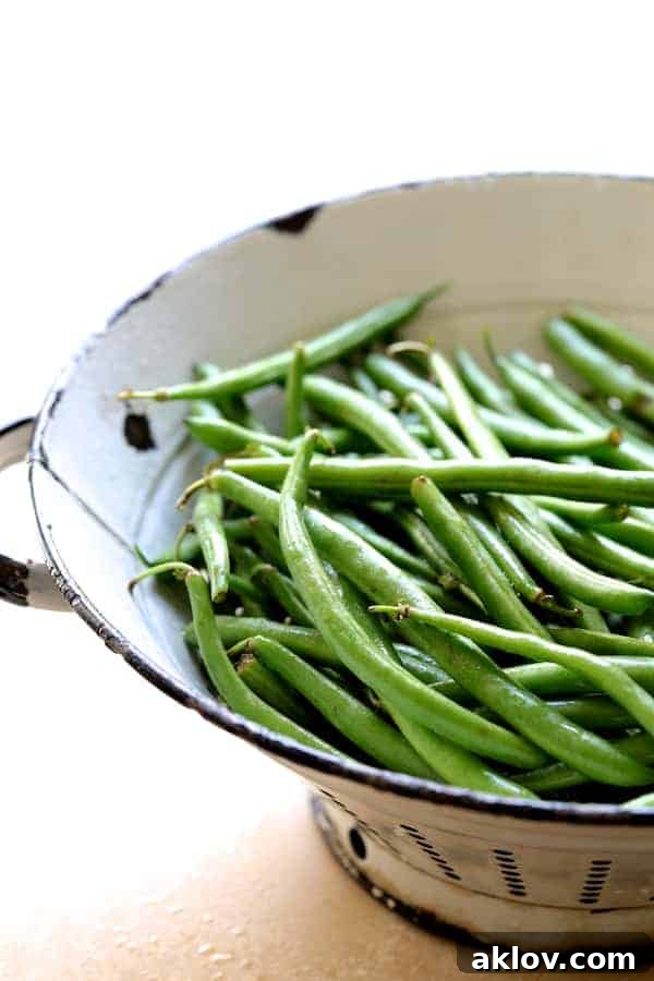 Rustic French Lentil Salad 6 Photo of fresh green beans in white colander.