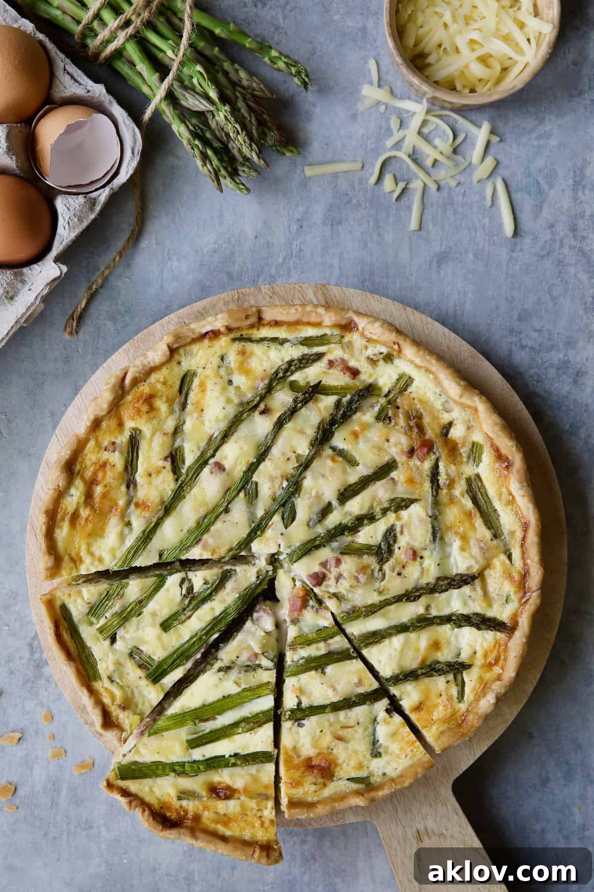 Savory Asparagus Tart with Prosciutto and Fontina 13 A close-up photo of the Asparagus Prosciutto and Fontina Tart, showing the rich texture of the custard and the asparagus tips.