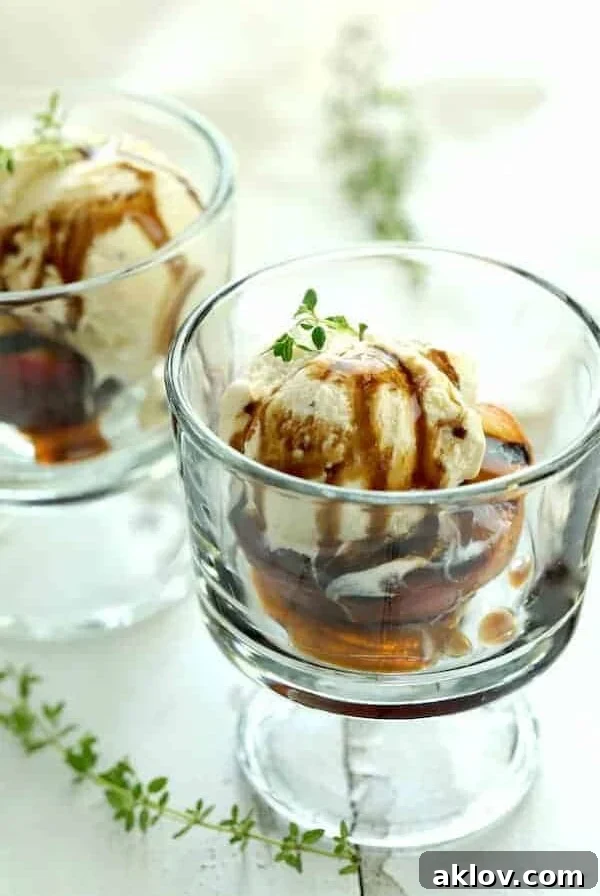 Grilled Peaches with Vanilla Ice Cream and Honey Balsamic Drizzle in dessert glasses.