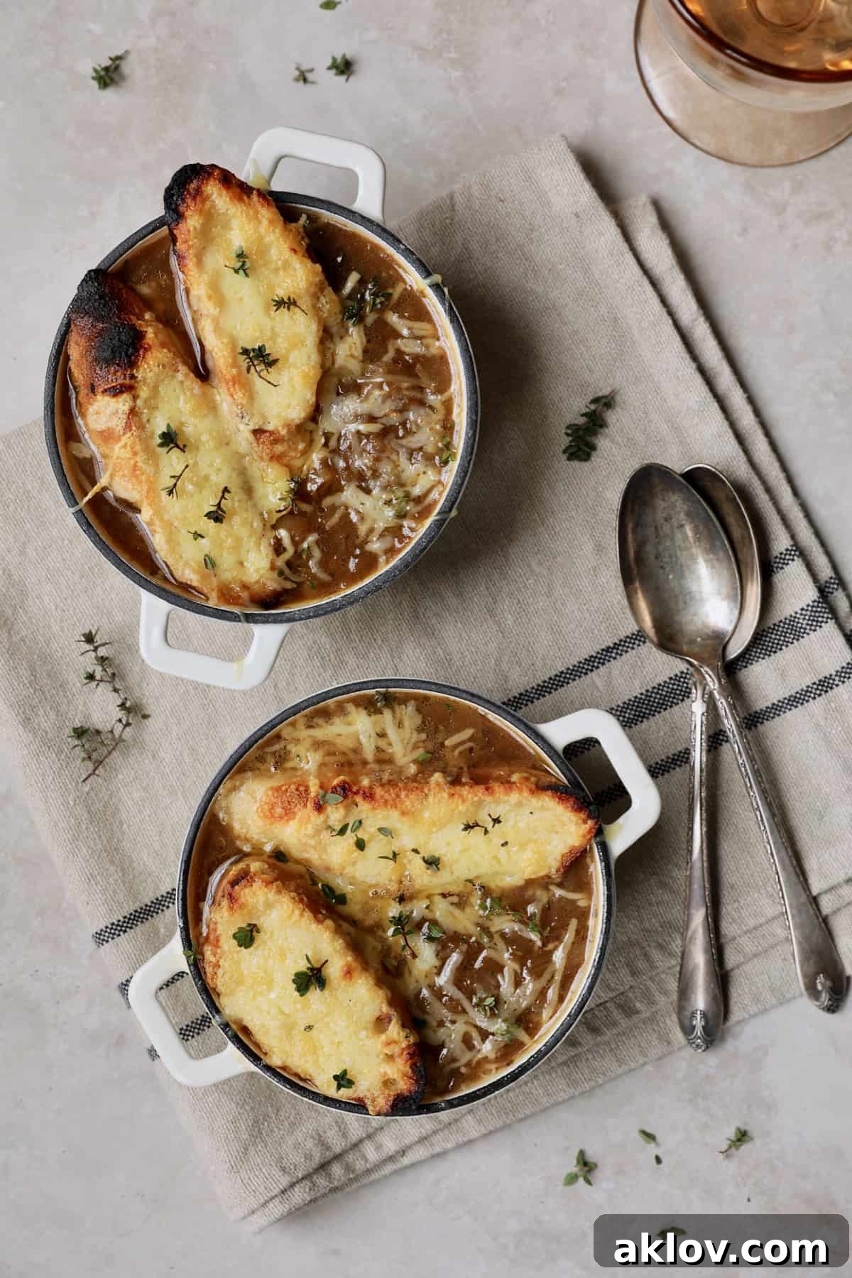 Date Night French Onion Indulgence 12 Photo of two bowls of Photo of French Onion Soup for Two with toasted bread and cheese on the top.