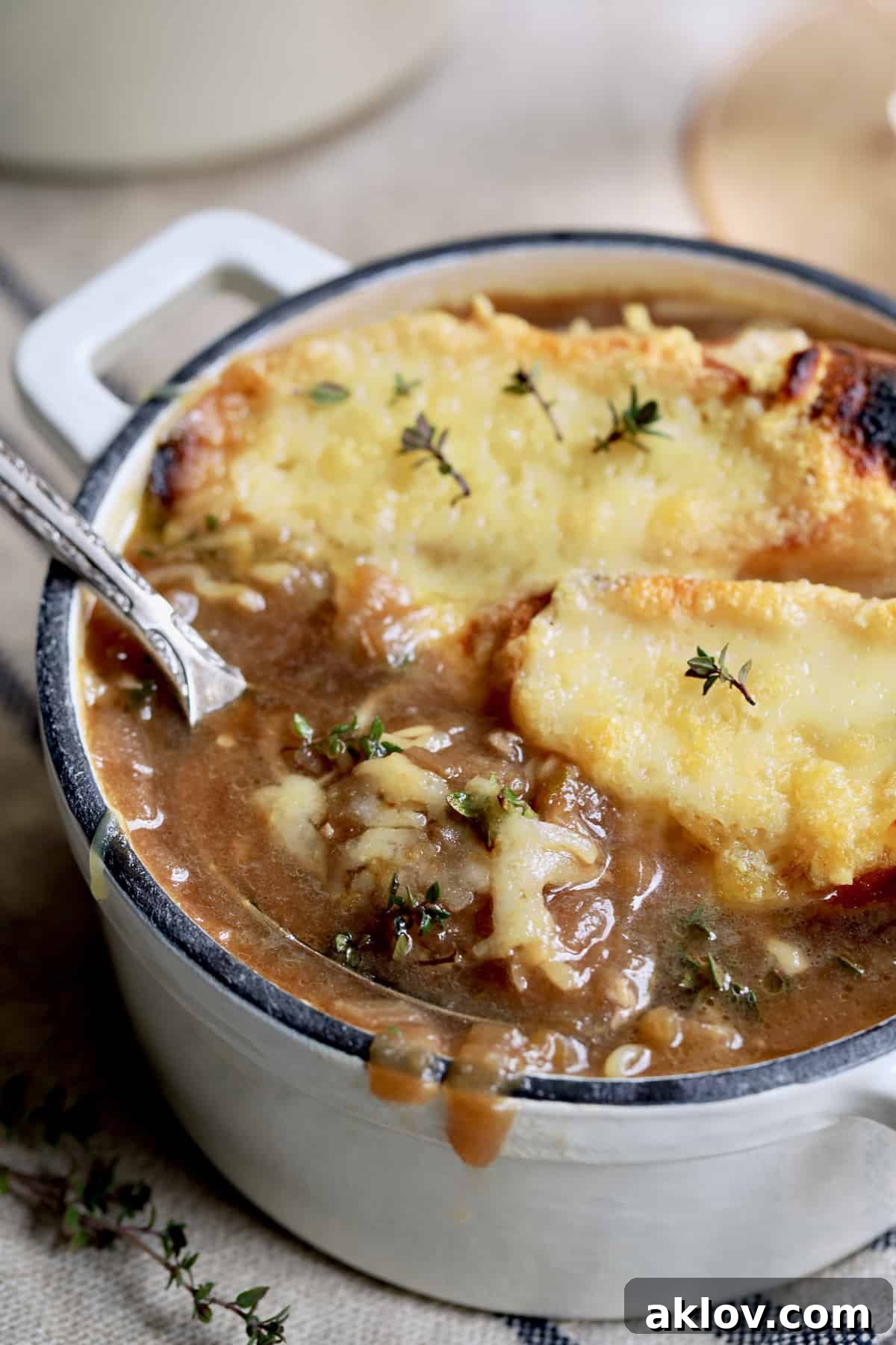 Date Night French Onion Indulgence 14 Photo of French Onion Soup for Two with spoon lifting out some of the soup.