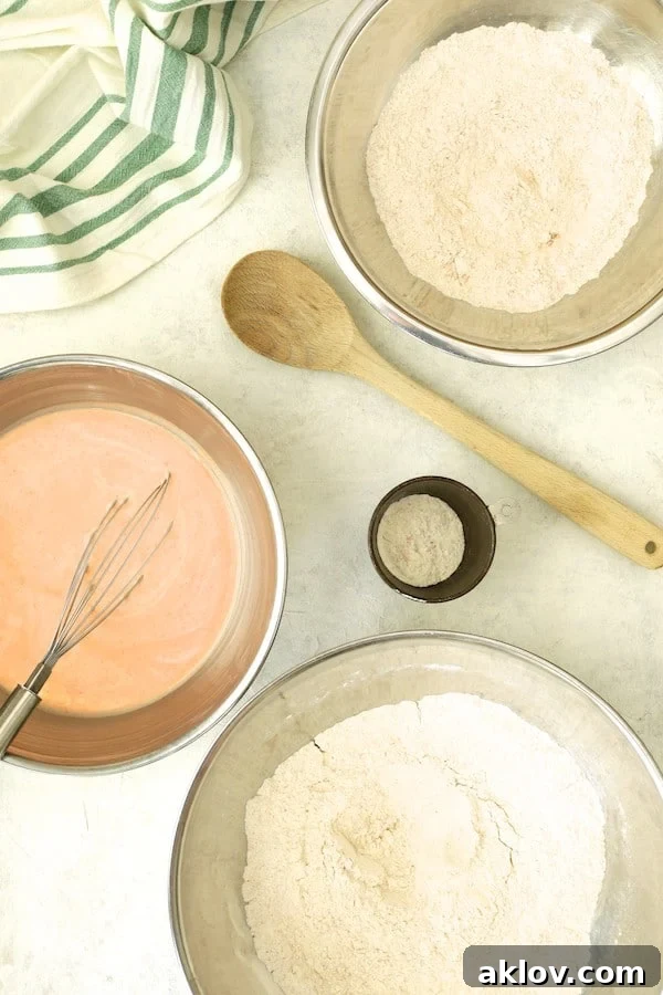 Photo of the set-up for battering the chicken with flour and buttermilk, an essential step for crispy Nashville Hot Chicken.