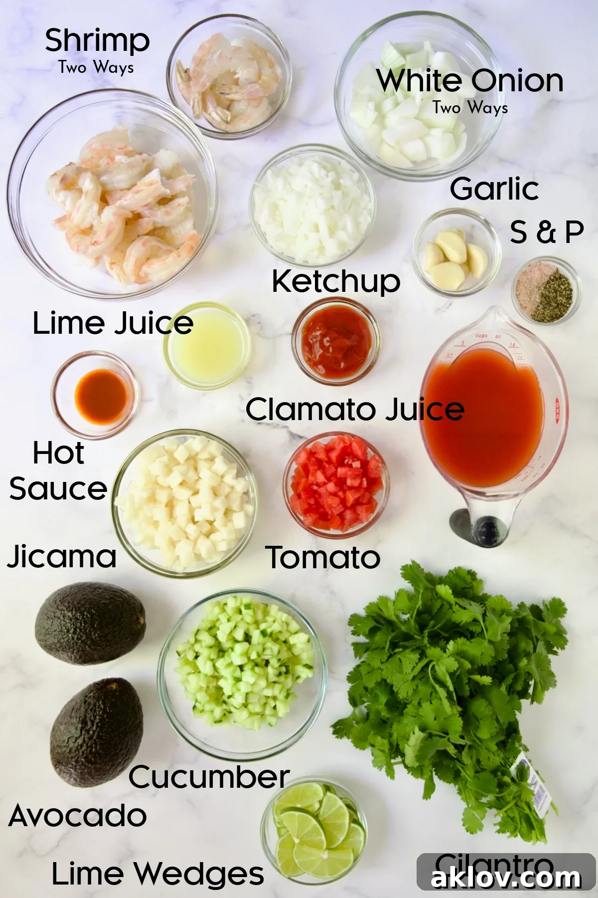 All the required ingredients for the Mexican Shrimp Cocktail recipe meticulously arranged on a clean countertop.