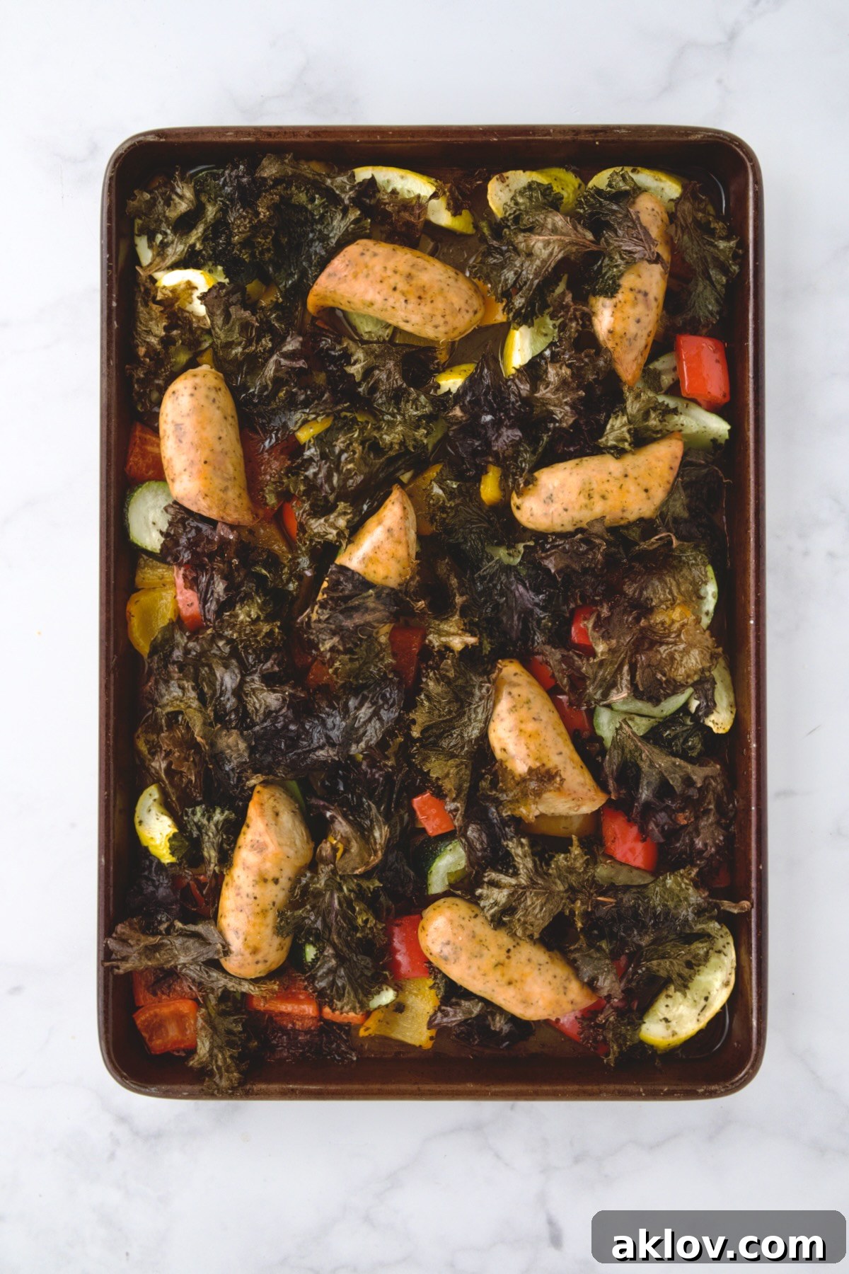 Finished Chicken Sausage Sheet Pan on rimmed sheet pan.