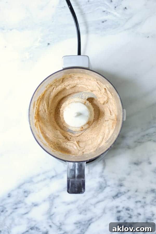 Photo of goat cheese butter in food processor.