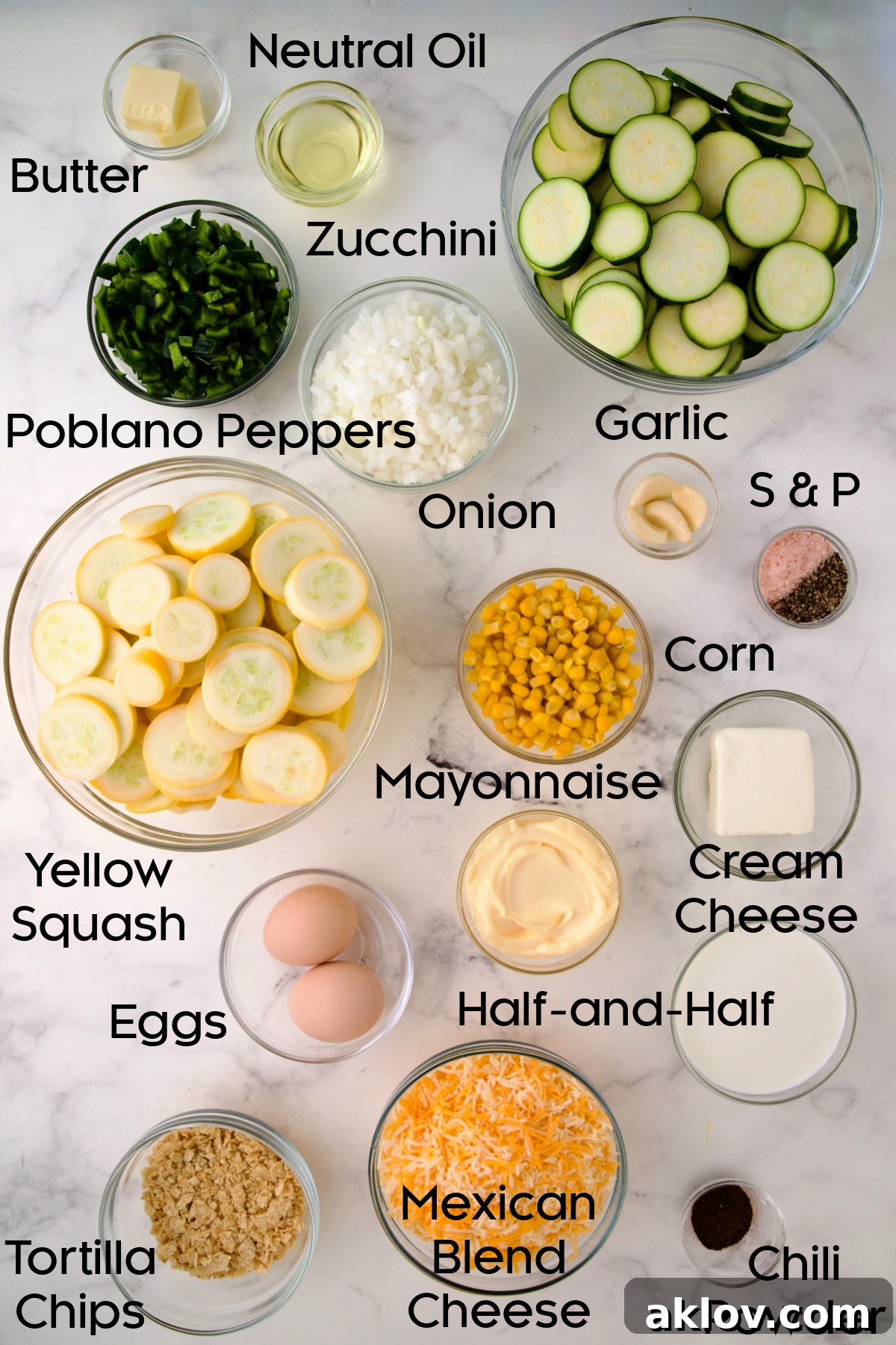 Glass bowls displaying various ingredients for Summer Squash Corn Poblano Casserole, including chopped vegetables and cheese.