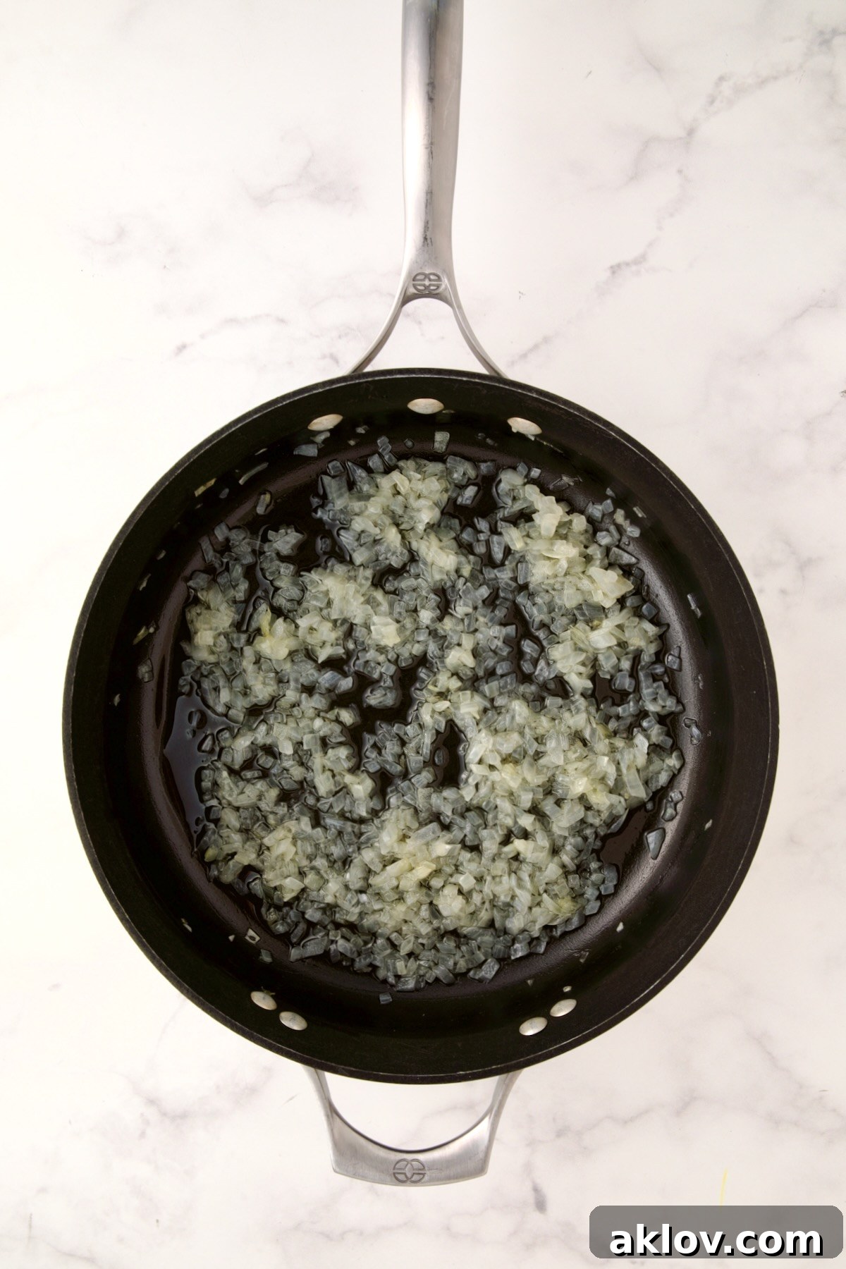 Softened onions in a nonstick skillet, gently translucent and fragrant.