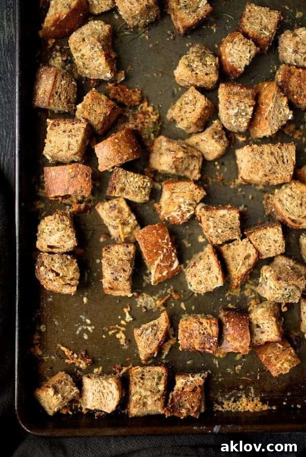 Whole grain croutons on baking sheet, golden and delicious.