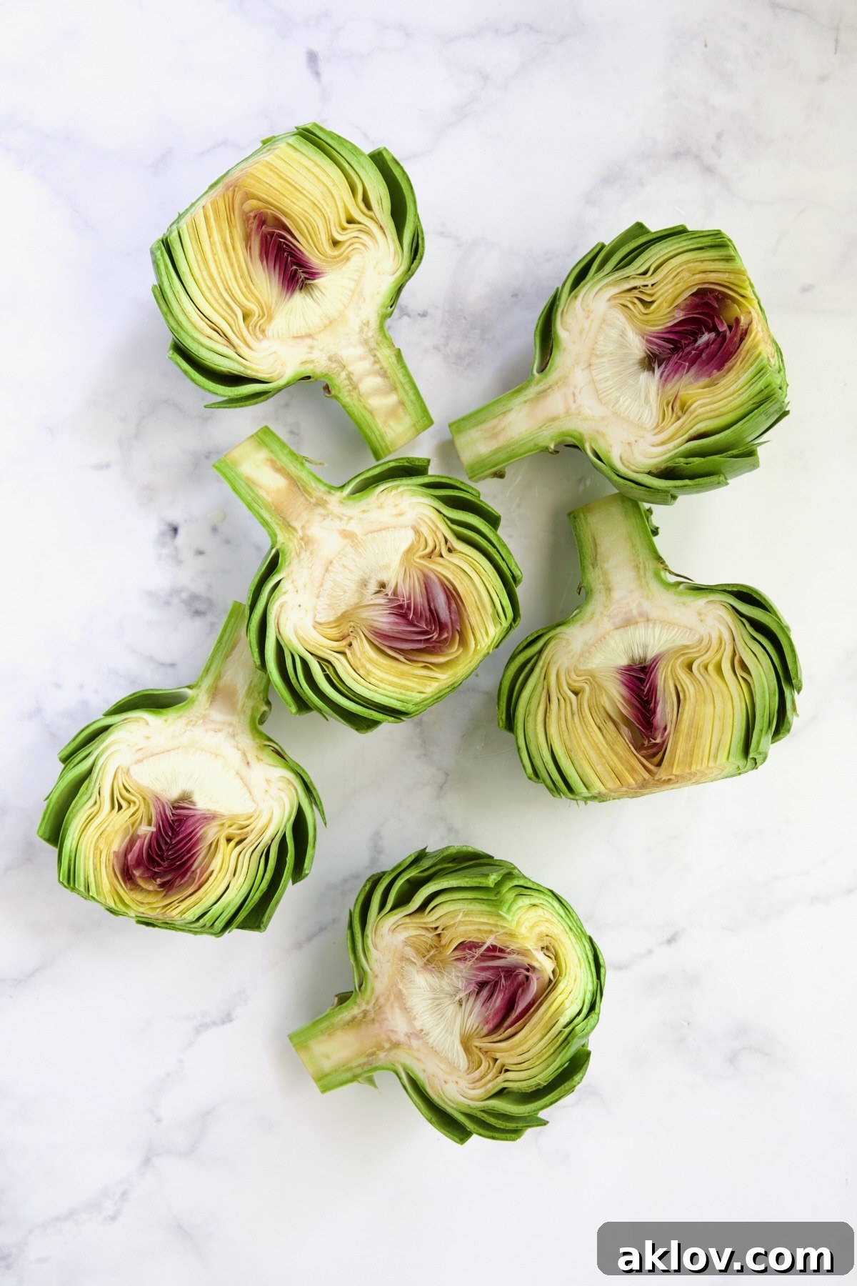 Buttery Garlic Roasted Artichokes 7 Six artichoke halves before the choke is removed.