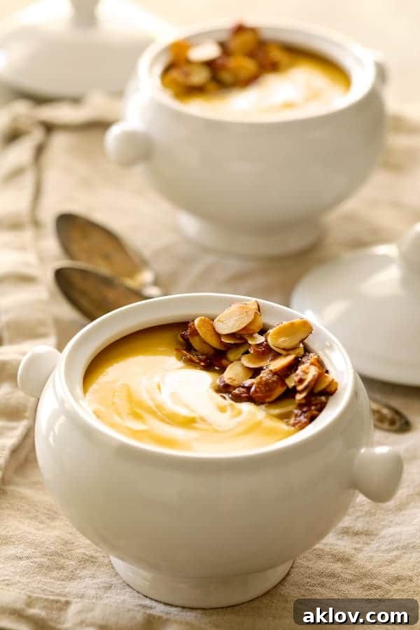 Marsala-Infused Pumpkin Velvet with Mascarpone Swirl 5 Photo of Pumpkin Soup with Marsala and Mascarpone in white bowls.