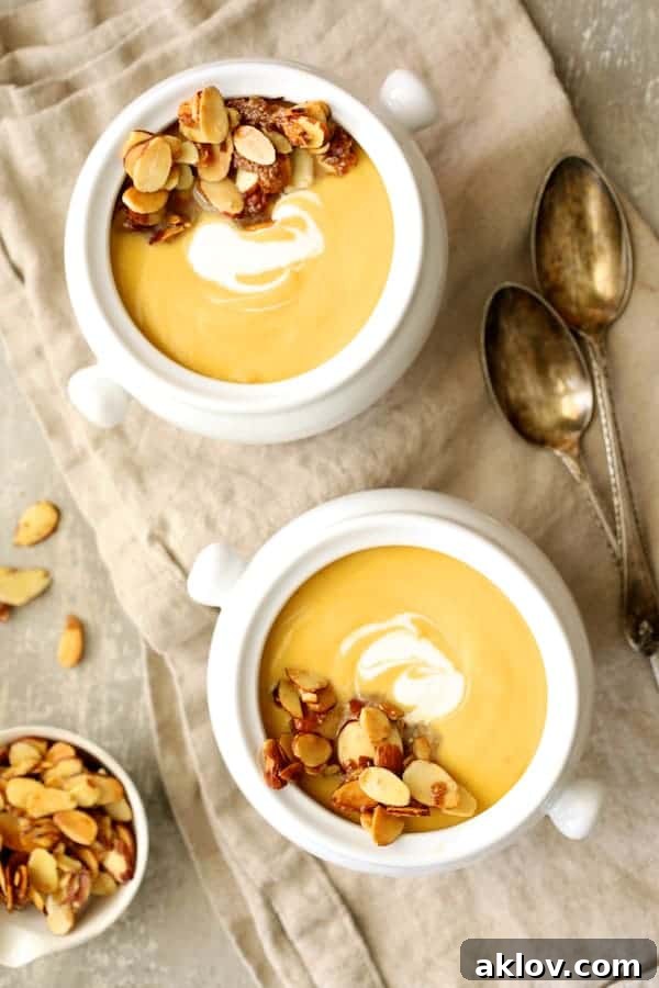 Marsala-Infused Pumpkin Velvet with Mascarpone Swirl 6 Photo of Pumpkin Soup with Marsala and Mascarpone in white bowls on beige napkin.
