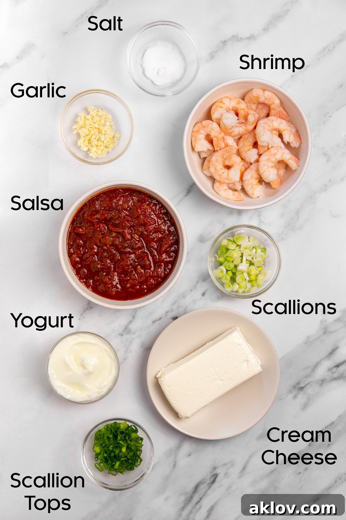 Individual bowls of ingredients for Creamy Shrimp Salsa Dip, including salsa, cream cheese, yogurt, scallions, garlic, and shrimp, ready for preparation.