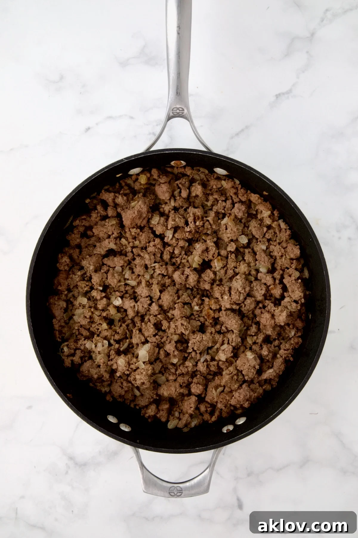 Cooked ground beef in nonstick skillet.