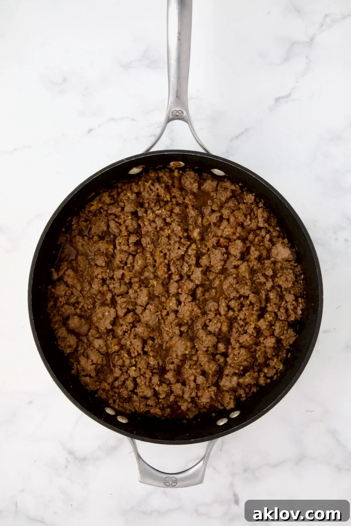 Cooked ground beef mixture in nonstick skillet.