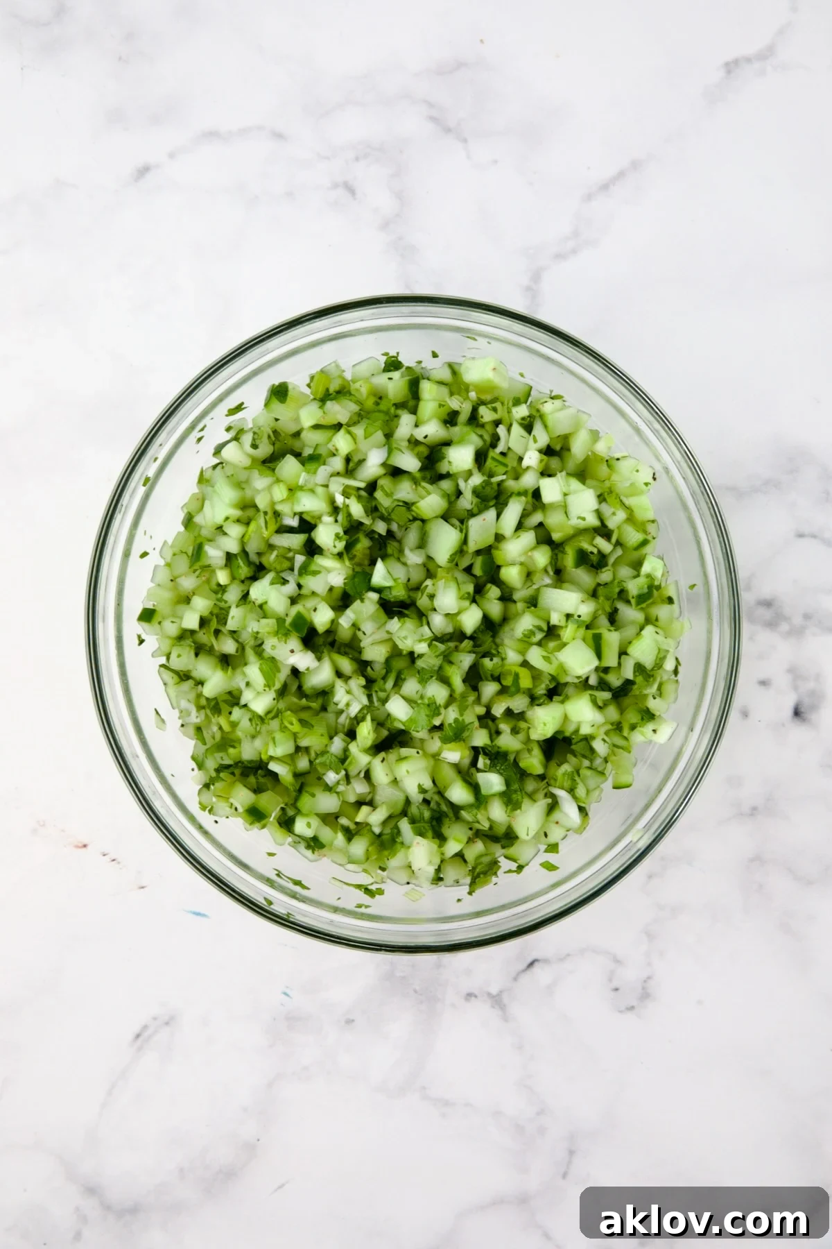 Cucumber relish in glass bowl.