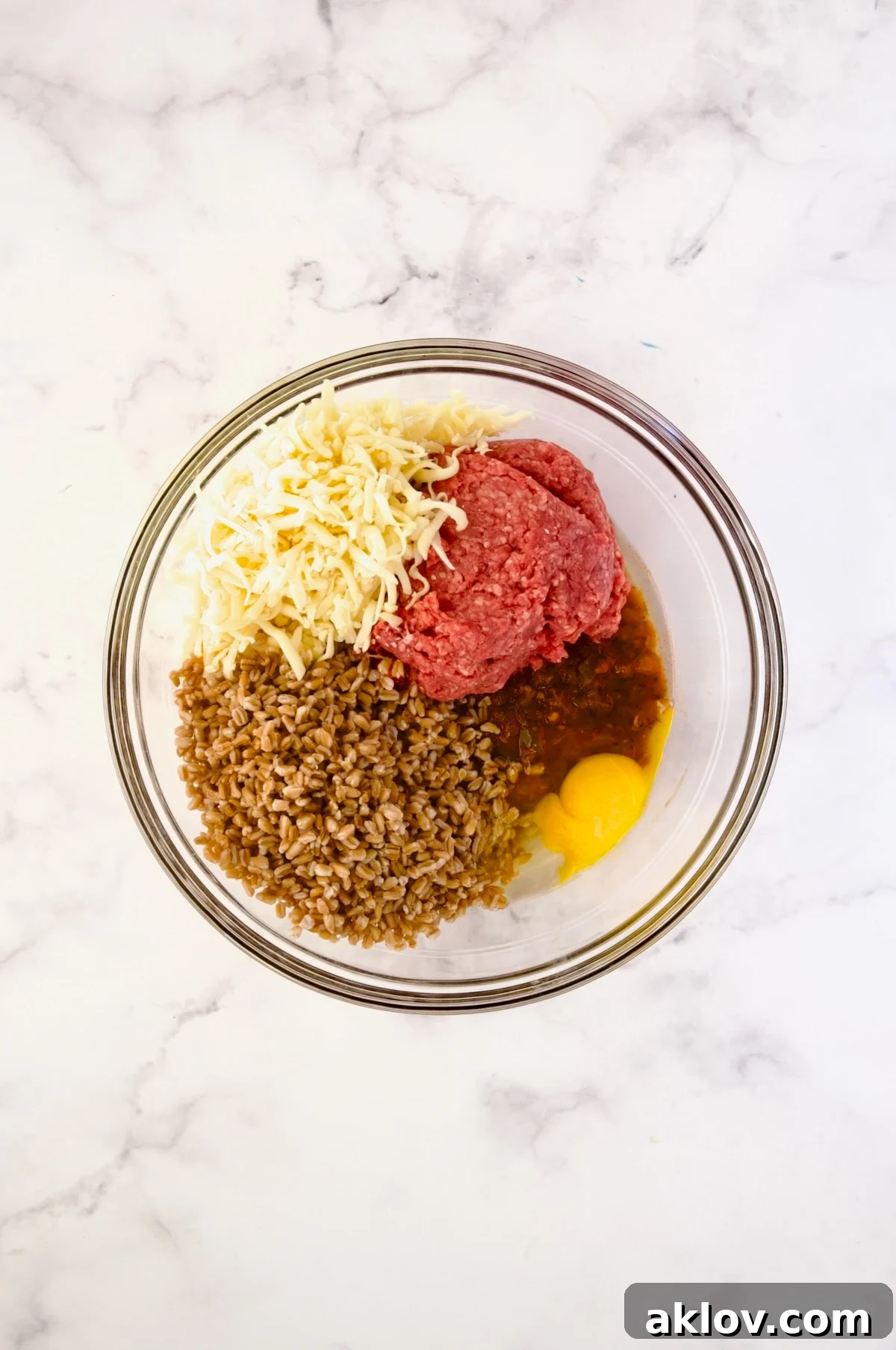 Ingredients for the Italian Stuffed Pepper filling in a glass bowl before mixing.