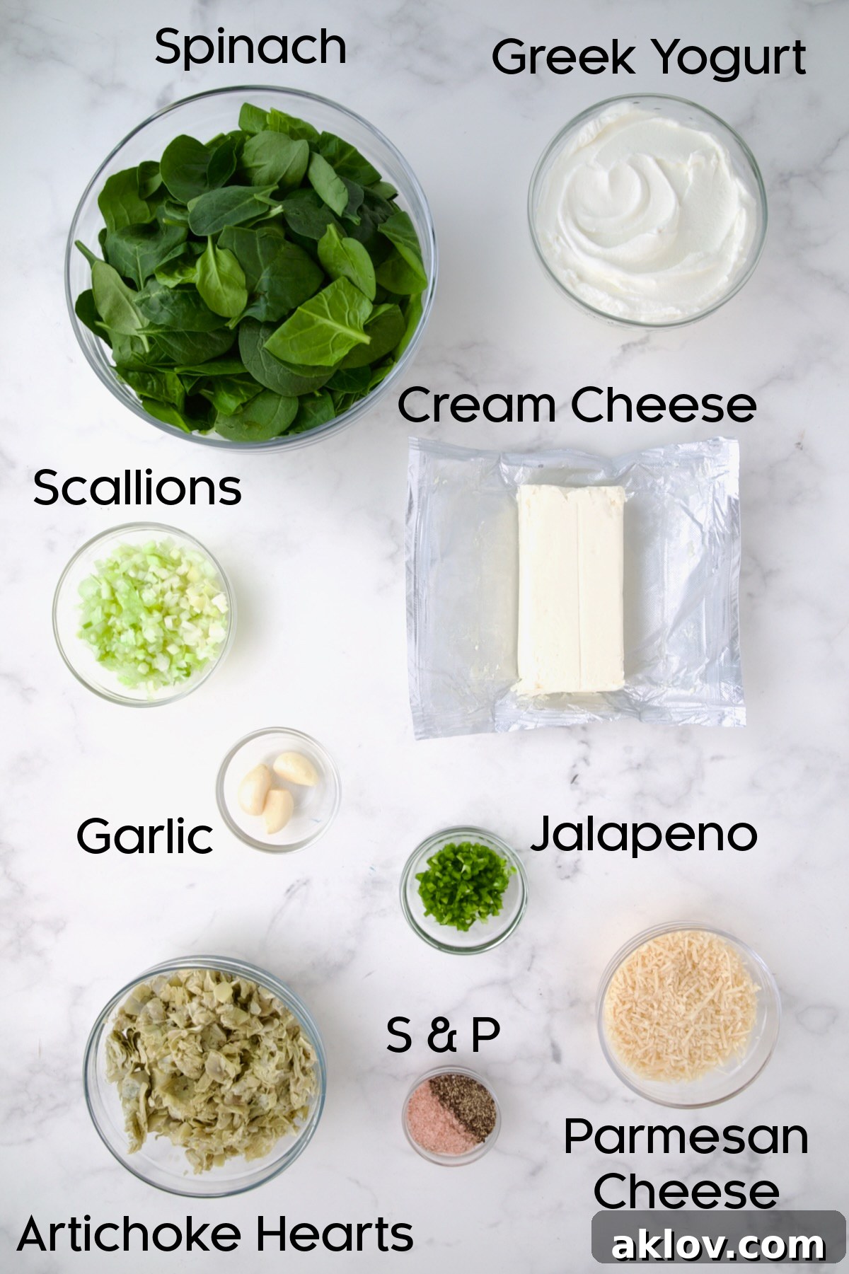 Ingredients for Spinach Artichoke Dip in glass bowls.