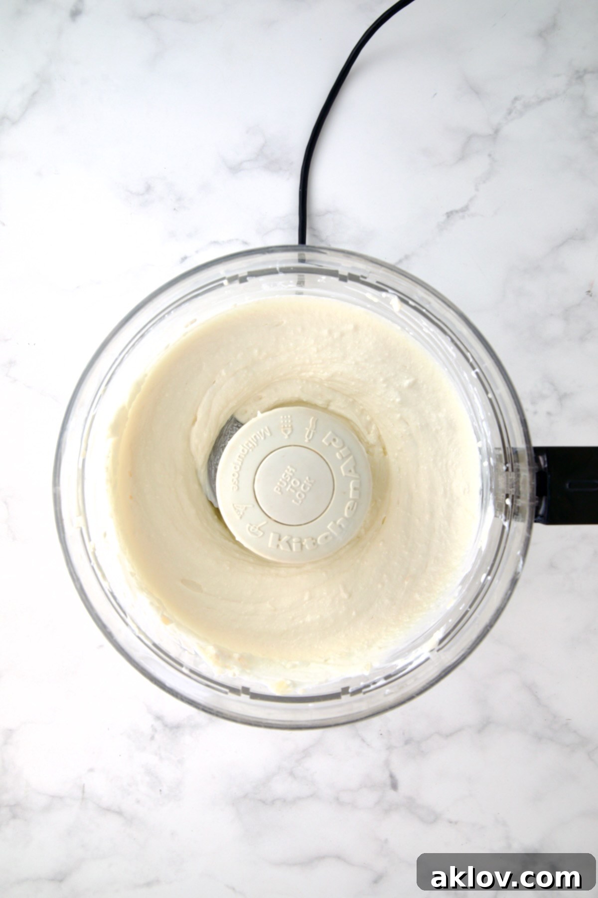 Yogurt and cream cheese in food processor.