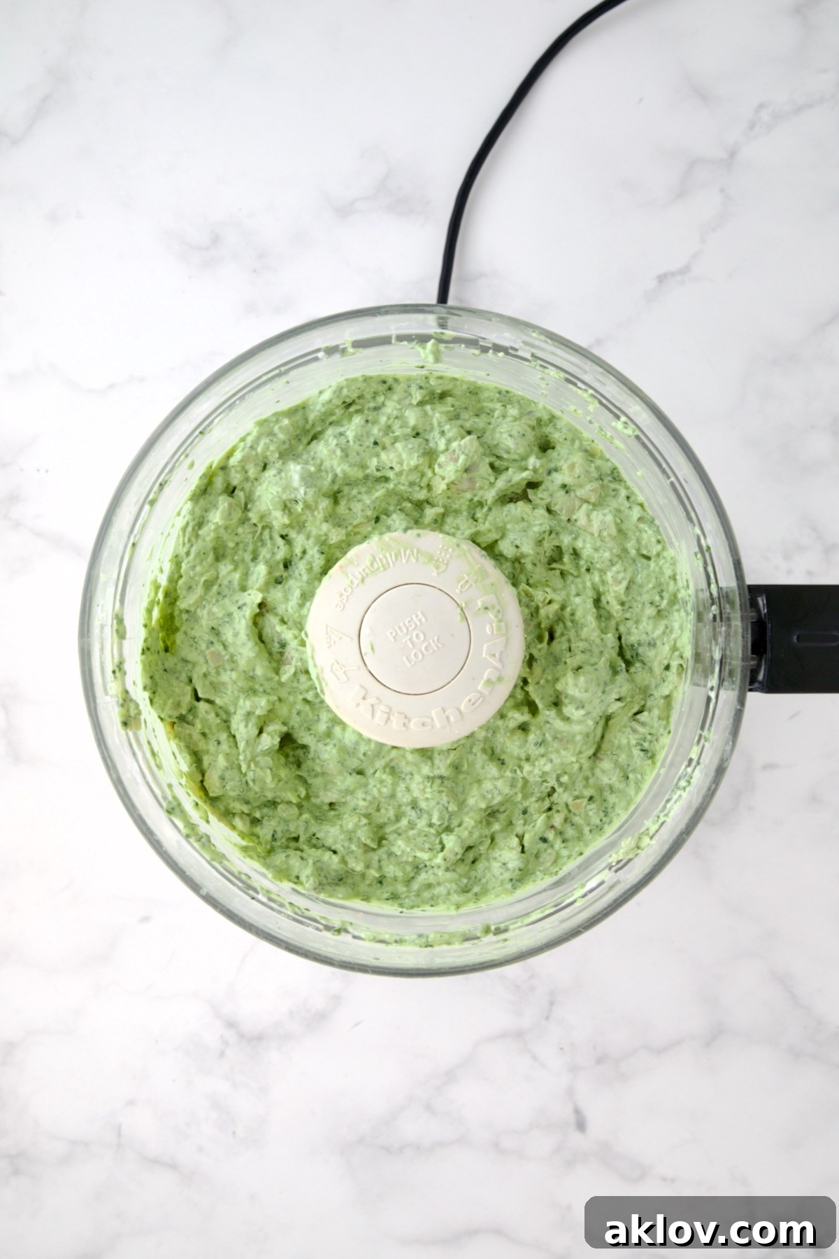 Finished dip in food processor with all ingredients combined.