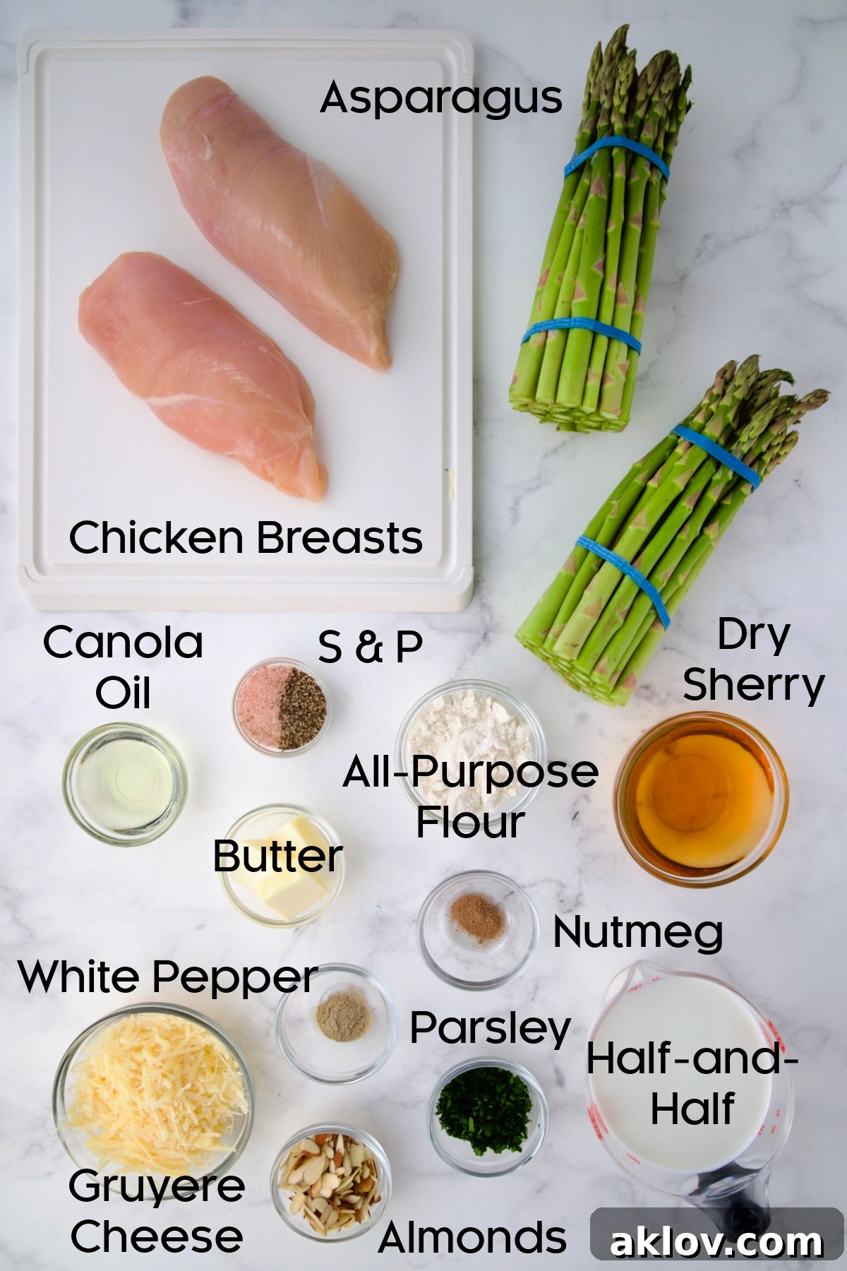 Array of fresh ingredients for Chicken Divan with Asparagus, neatly arranged in glass bowls on a wooden surface.