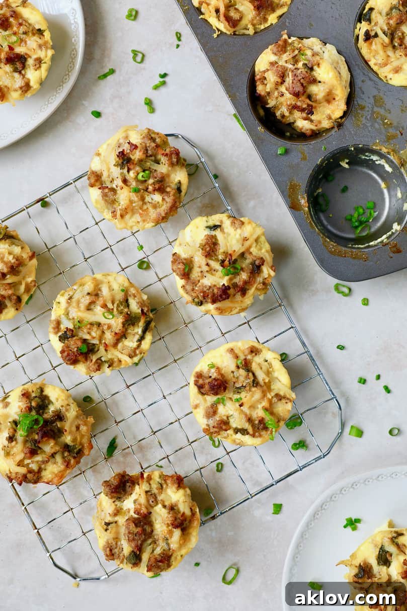 A stunning final presentation of Hash Brown Breakfast Muffins with Poblano Peppers and Gouda Cheese, garnished with chives, showcased on a wire cooling rack.