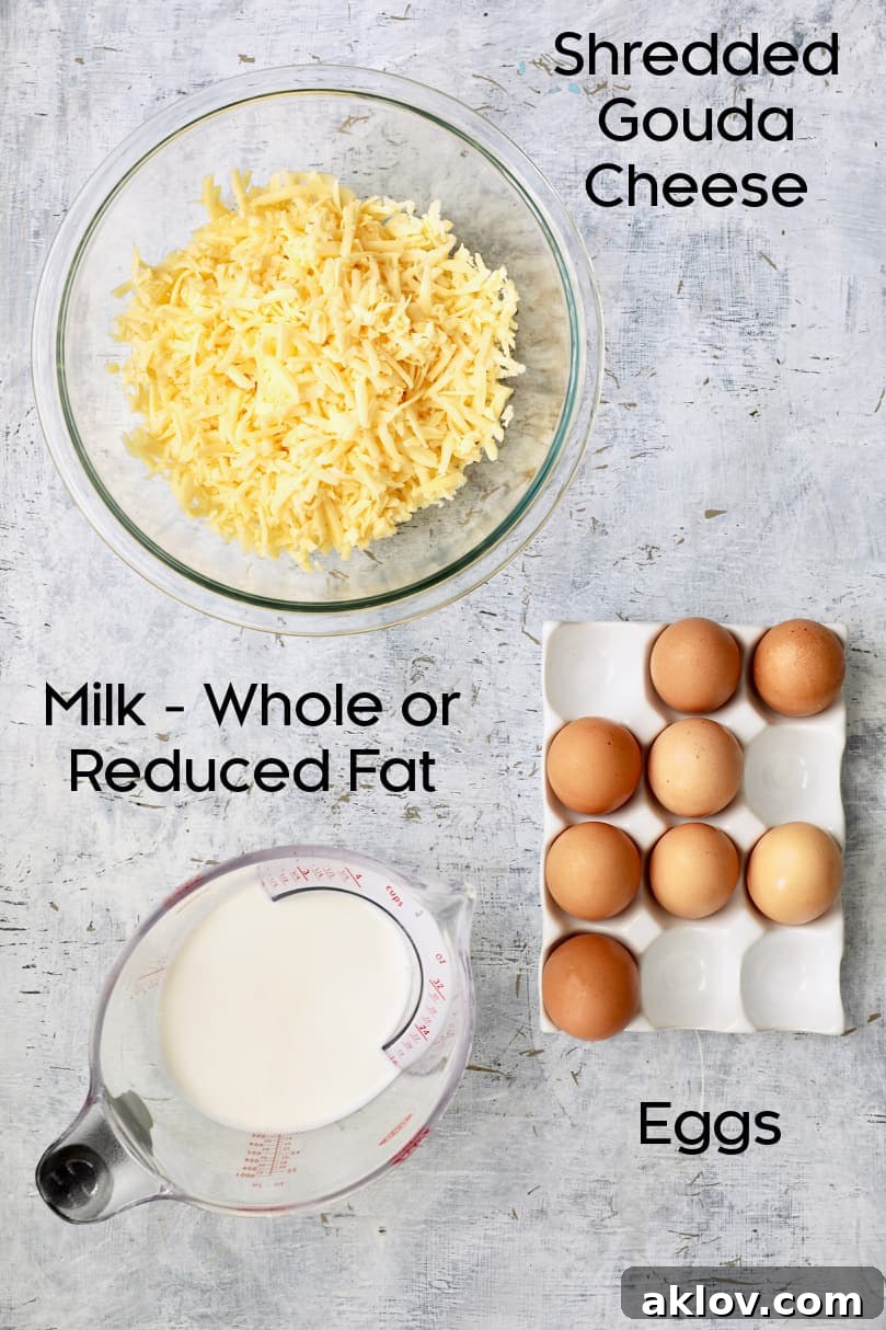 Overhead view of fresh eggs, milk, and other key ingredients neatly arranged for making breakfast muffins.