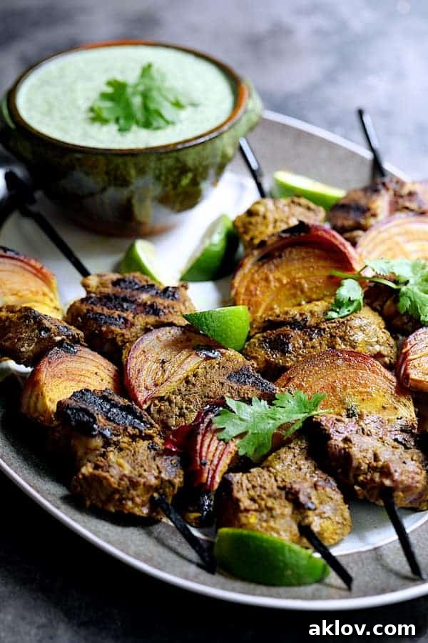 Delicious Indian-Style Beef Kabobs with Cilantro-Coconut Sauce served with basmati rice and naan bread
