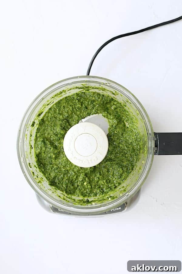 Photo of spicy basil chimichurri in food processor after processing.