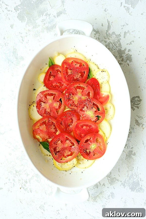 Photo of the tomato layer over the yellow squash.